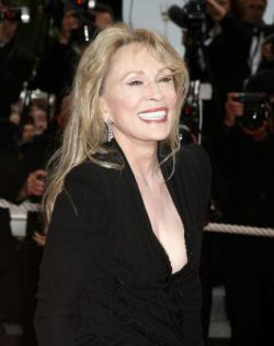 Faye Dunaway, looking great at 67 (although the porcelain covered Chiclet teeth 'bout like to blind me).